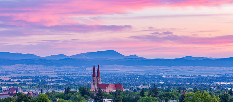A panoramic photograph of Helena and the Sleeping Giant Mountains at sunset.